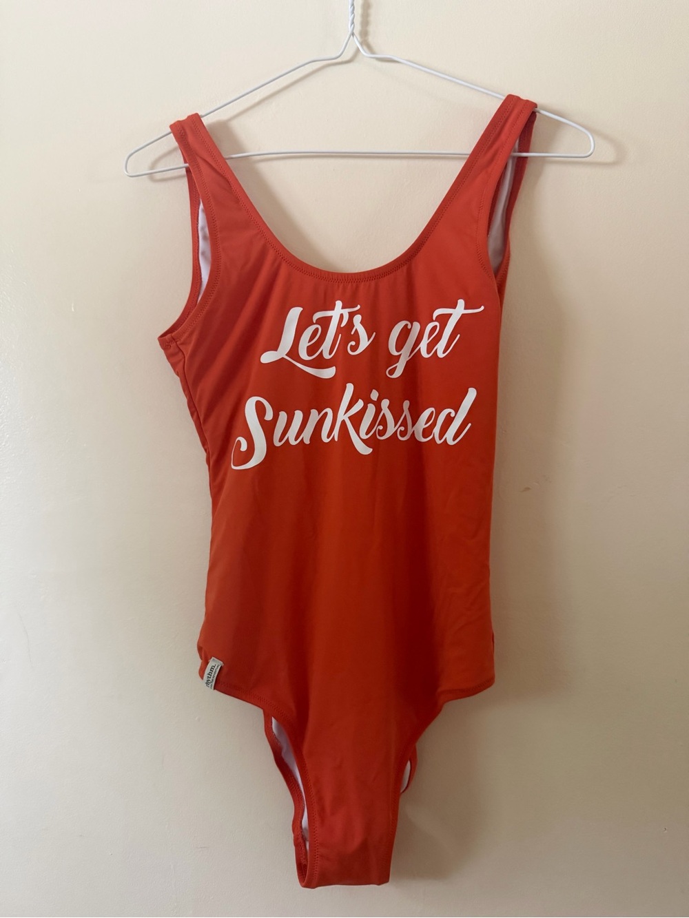 Rhythm. Orange One-Piece Swimsuit with 'Let's get Sunkissed' Print